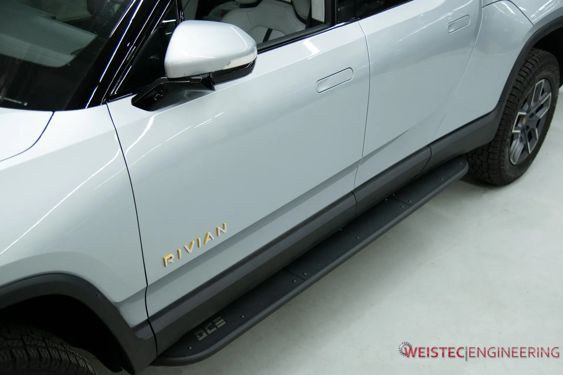 Rivian Side View Showcasing DCE Rock Slider, Running Board, Side Step